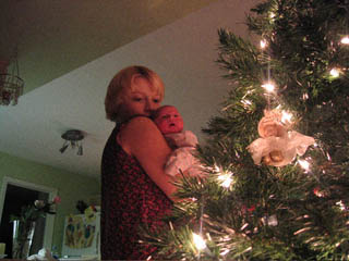 tracey with ava, looking at xmas tree